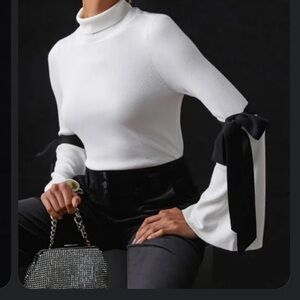 Anthropologie - Maeve mock neck bow bell sleeve sweater (as seen on Nuuly)